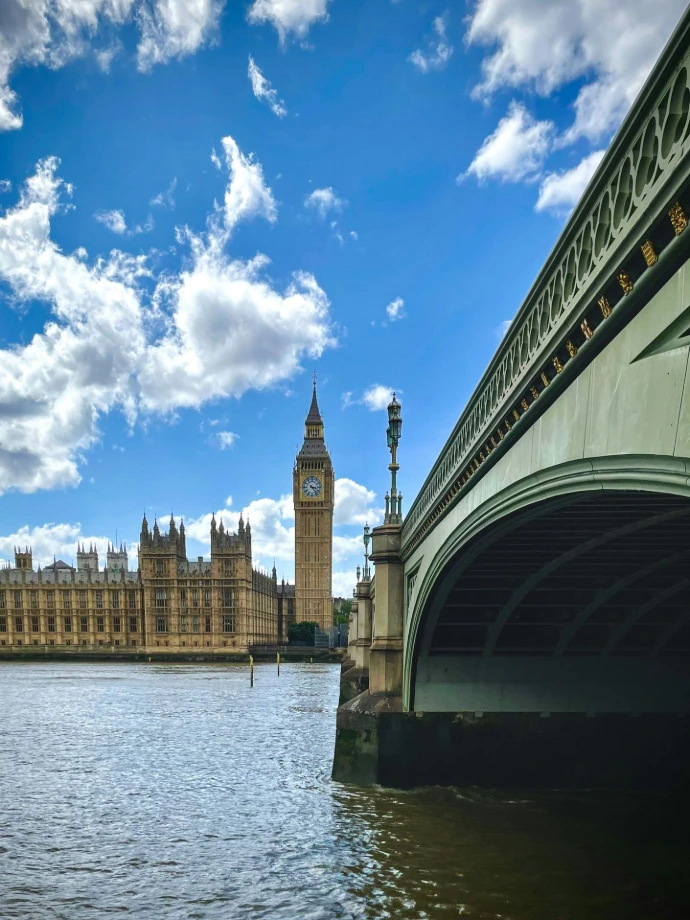 the big ben clock tower towering over the city of london